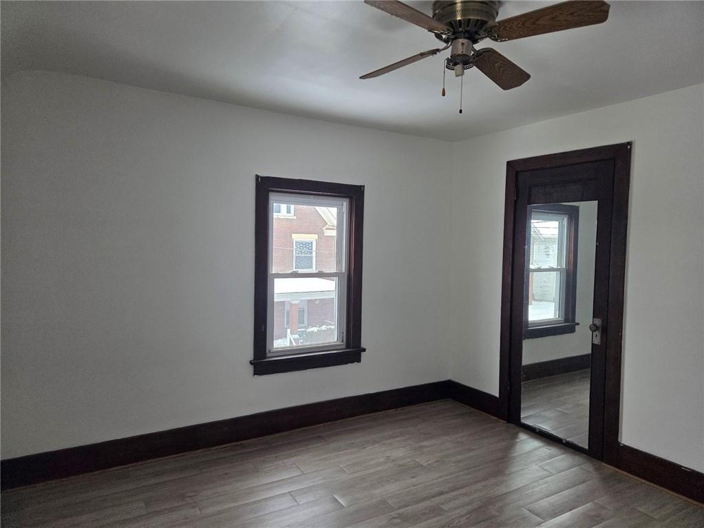 306 Spruce Street Butler, PA 16001 - Photo 46 of 47 an empty room with wooden floor closet and windows