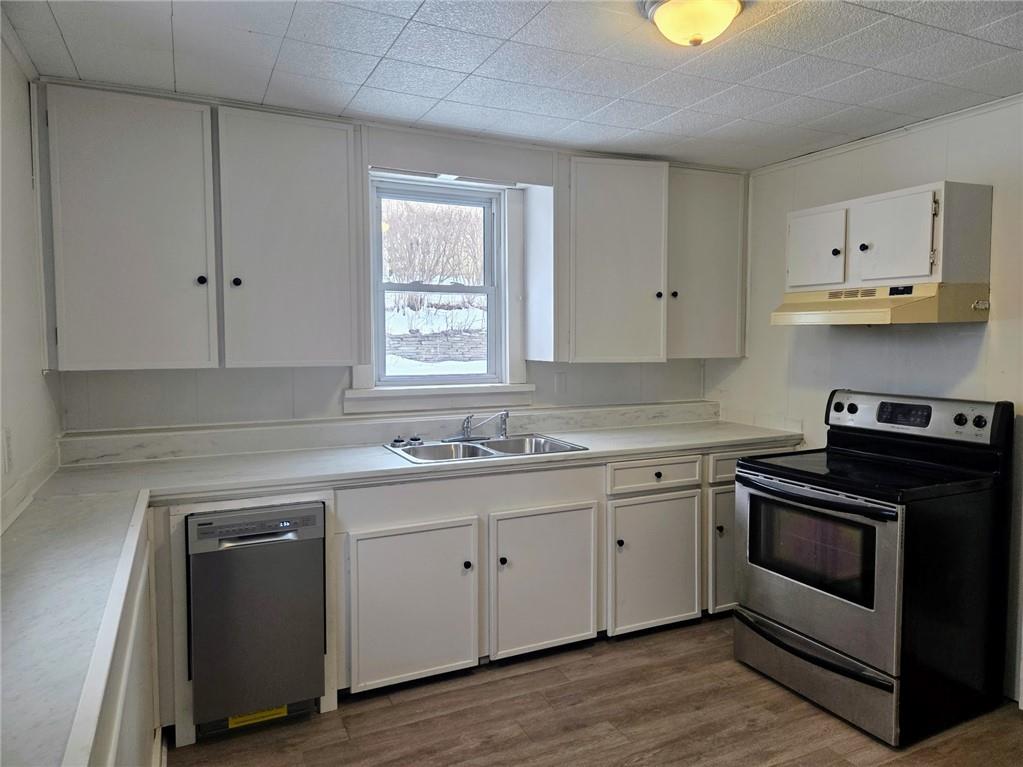 306 Spruce Street Butler, PA 16001 - Photo 8 of 47 a kitchen with granite countertop white cabinets and white appliances