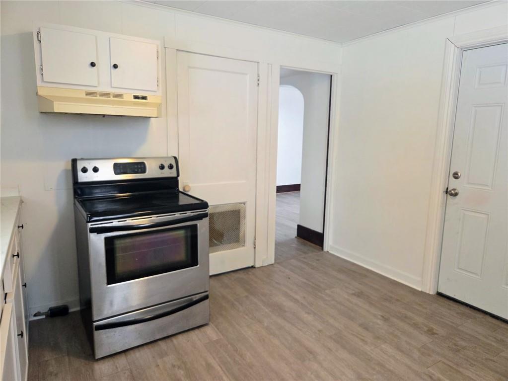 306 Spruce Street Butler, PA 16001 - Photo 10 of 47 a kitchen with granite countertop white cabinets and stainless steel appliances