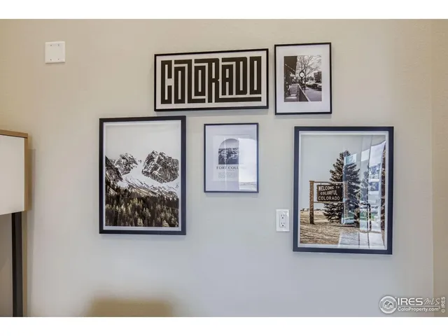 a view of a hallway with paintings on the wall