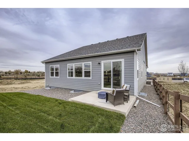 a house view with a sitting space and garden