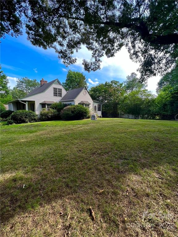 2525 Holbrook Road Fort Mill, SC 29715 - Photo 1 of 29 a view of a green field with house in the background