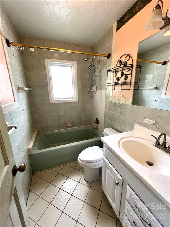 2525 Holbrook Road Fort Mill, SC 29715 - Photo 15 of 29 a bathroom with a sink a toilet a mirror a bath tub and shower