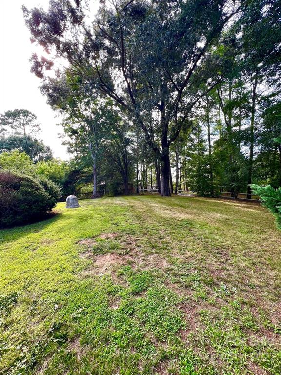 2525 Holbrook Road Fort Mill, SC 29715 - Photo 27 of 29 a view of a green field with trees