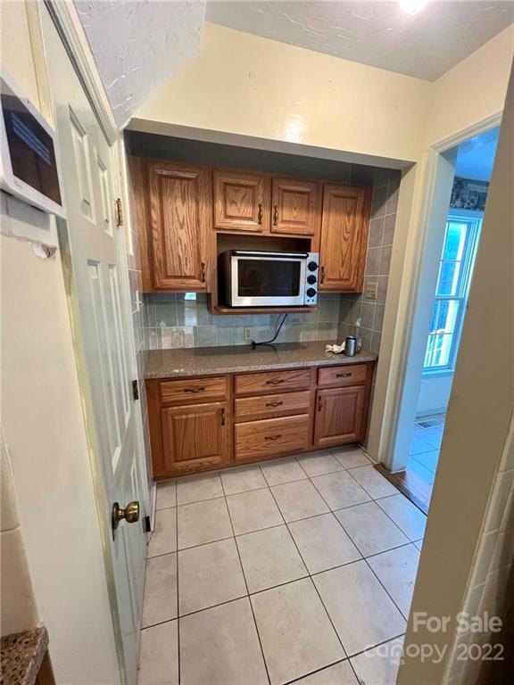 2525 Holbrook Road Fort Mill, SC 29715 - Photo 5 of 29 a kitchen with stainless steel appliances a refrigerator and a sink