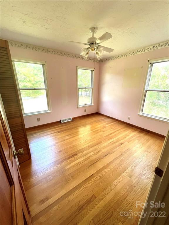 2525 Holbrook Road Fort Mill, SC 29715 - Photo 9 of 29 wooden floor in an empty room with a window
