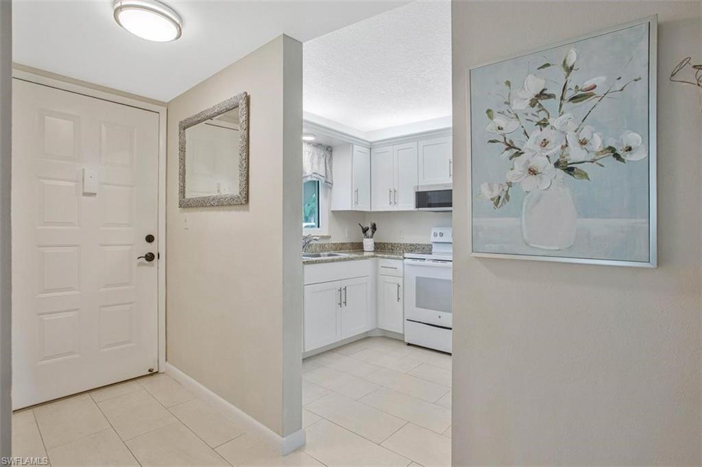 4258 27th Court Southwest, Unit 106 Naples, FL 34116 - Photo 6 of 19 This bright and light condo will bring you joy.