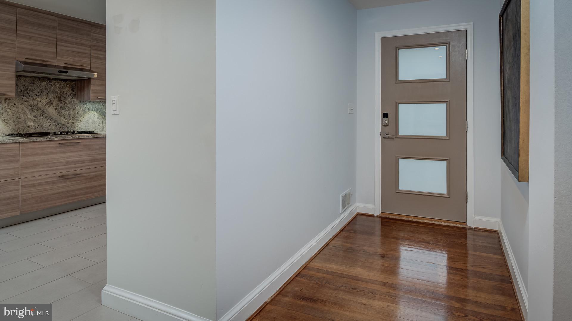 6212 Wedgewood Road Bethesda, MD 20817 - Photo 4 of 38 Entrance hall. New door with code lock