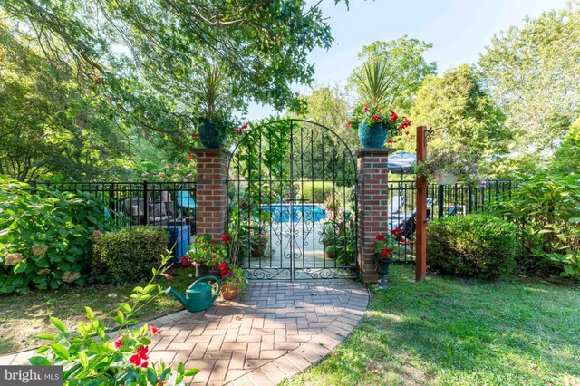 a view of street with tall buildings and a big yard