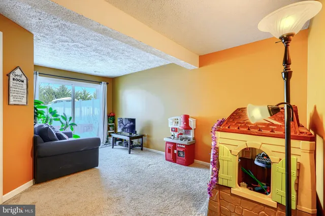 a bedroom with a bed and a dresser in it