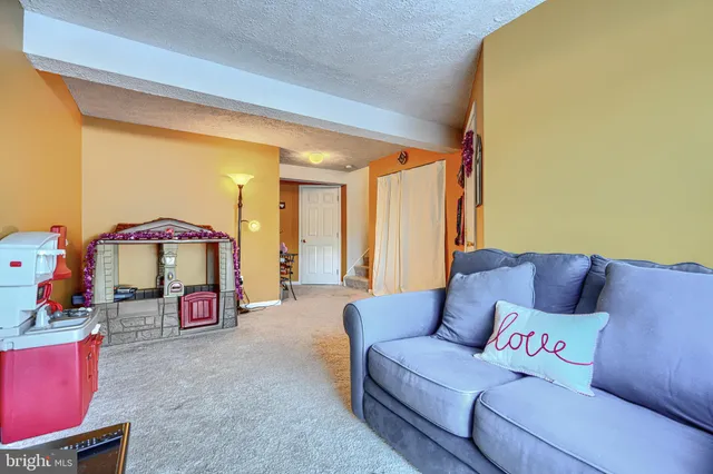 a view of a room with wooden floor and fence