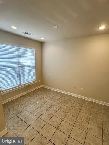 a view of a brick house with many windows