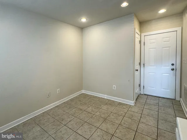 a front view of a building with a yard