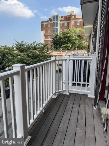 a view of a brick building with many windows