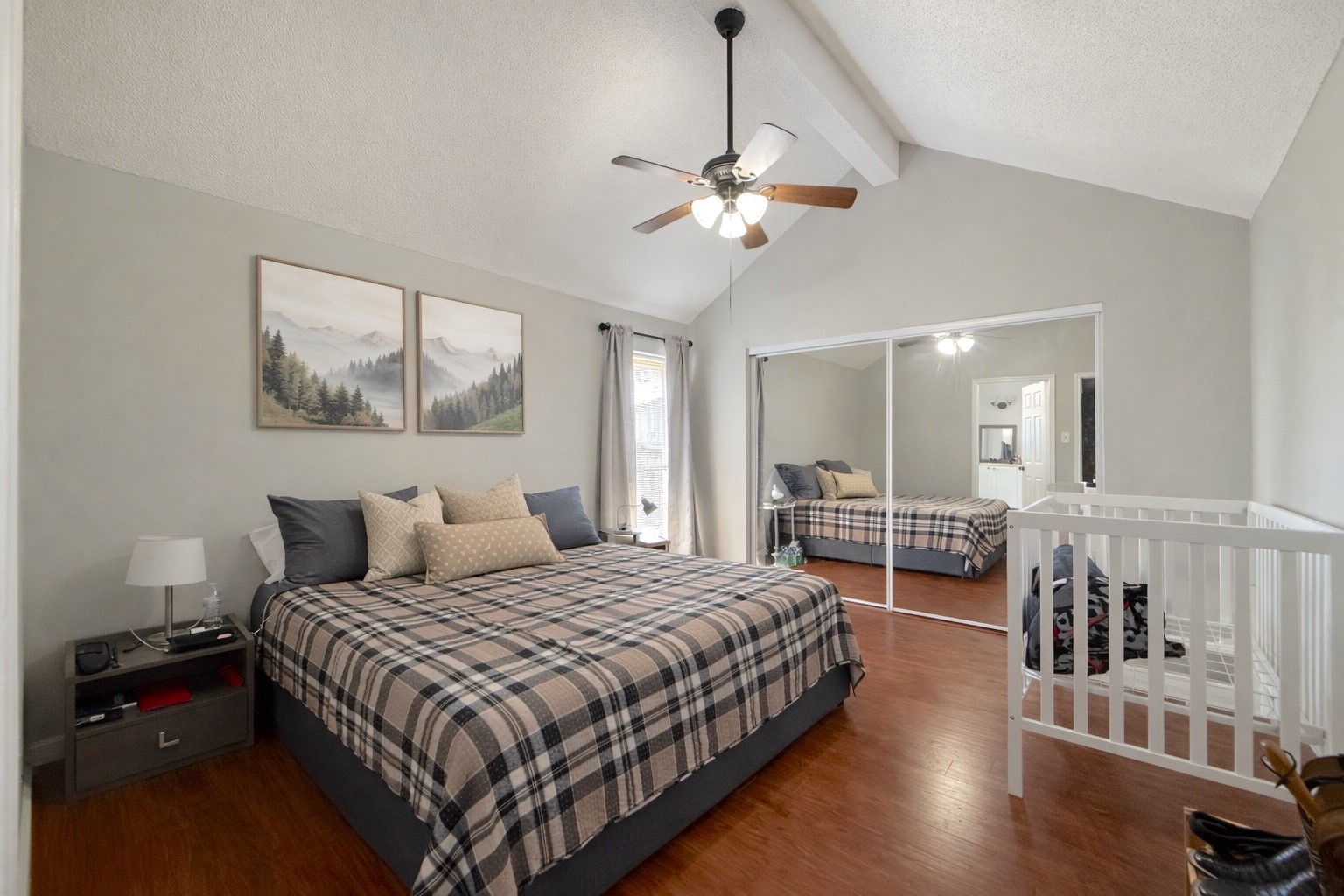 17007 Spruce Run Drive Spring, TX 77379 - Photo 12 of 23 a bedroom with a large bed and a chandelier