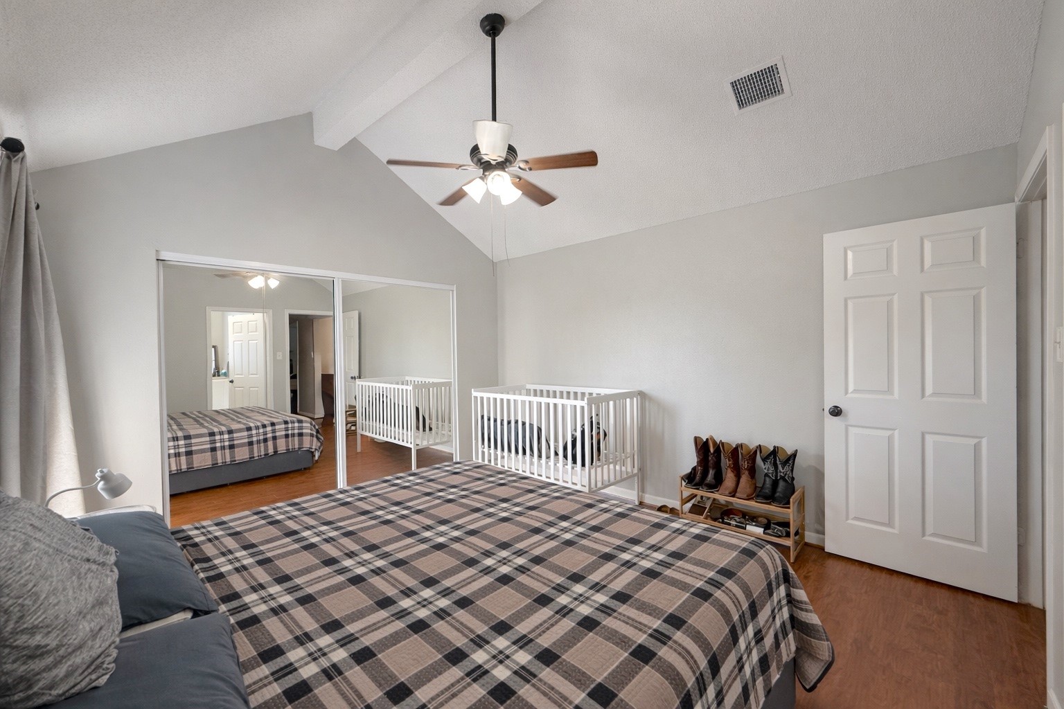 17007 Spruce Run Drive Spring, TX 77379 - Photo 13 of 23 a bedroom with a bed and a chandelier