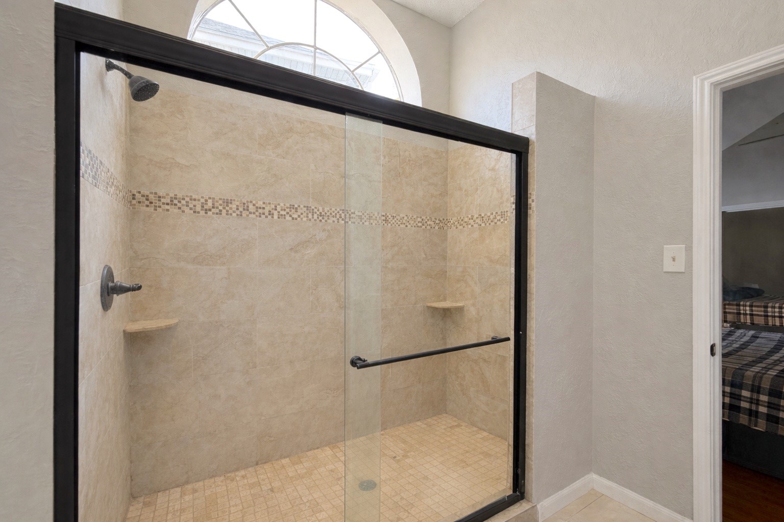 17007 Spruce Run Drive Spring, TX 77379 - Photo 15 of 23 a bathroom with a glass shower door