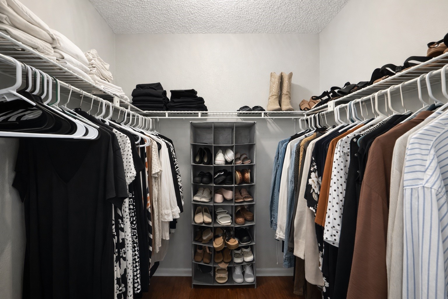 17007 Spruce Run Drive Spring, TX 77379 - Photo 18 of 23 a view of walk in closet with clothes and shoes