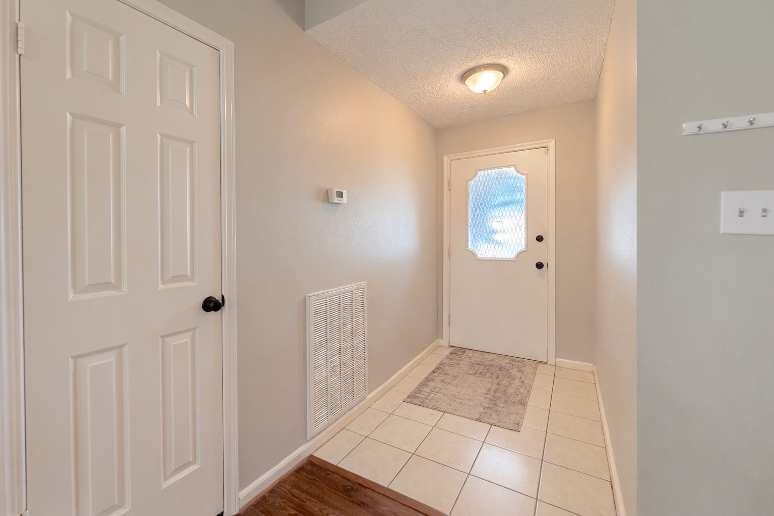 17007 Spruce Run Drive Spring, TX 77379 - Photo 3 of 23 a view of a bathroom from a hallway