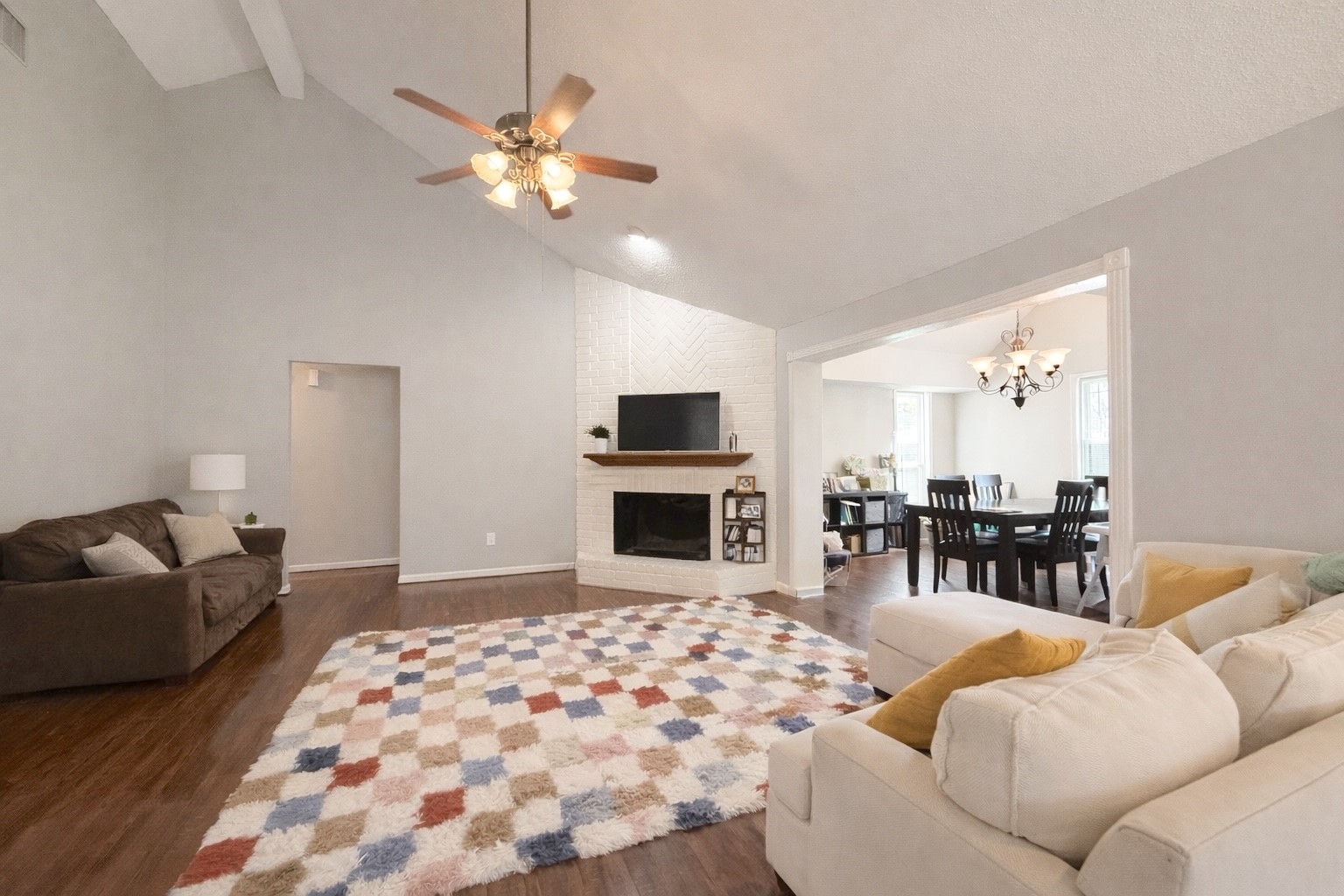 17007 Spruce Run Drive Spring, TX 77379 - Photo 4 of 23 a living room with furniture a chandelier and a flat screen tv