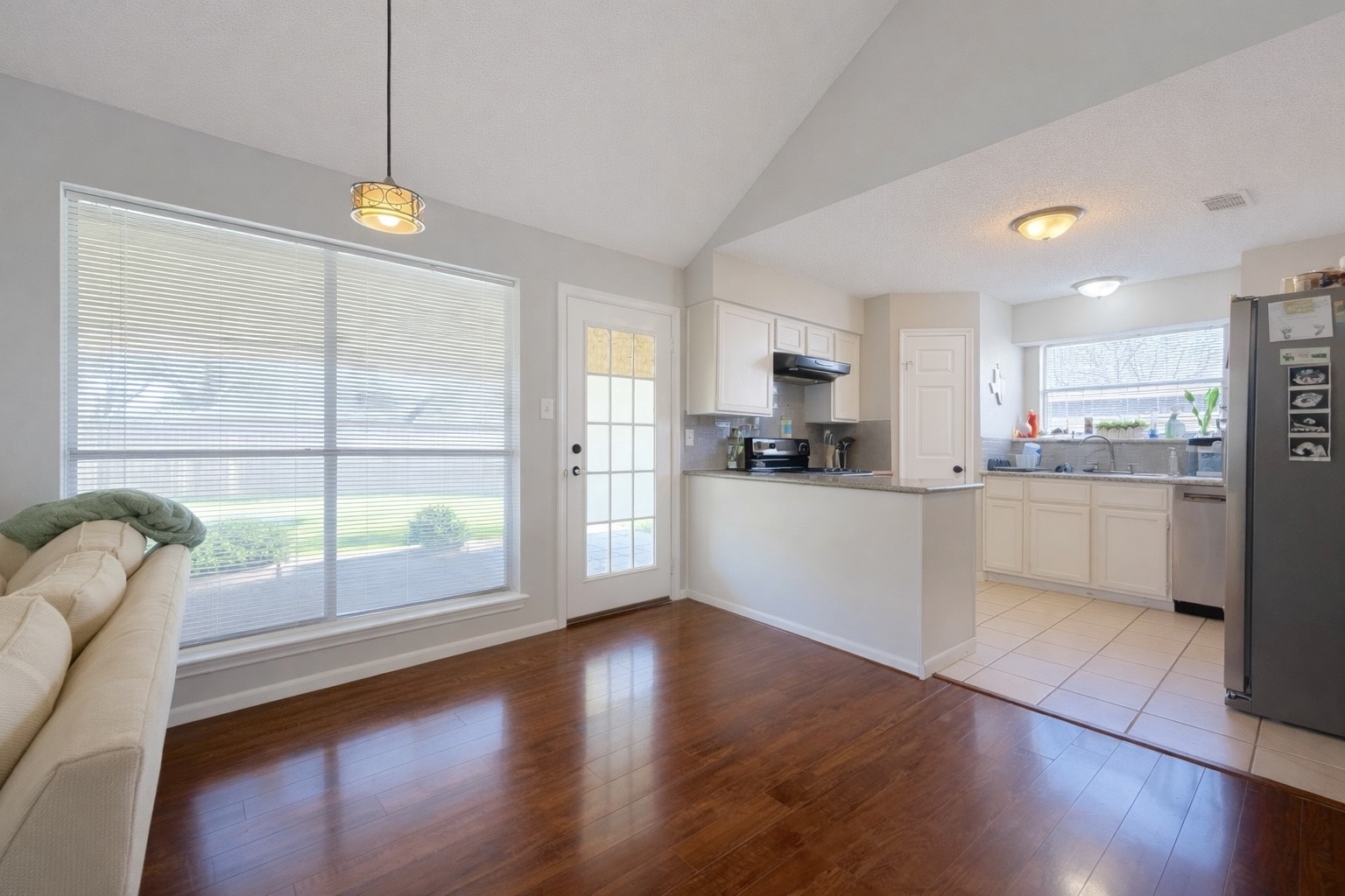 17007 Spruce Run Drive Spring, TX 77379 - Photo 8 of 23 a view of kitchen with refrigerator and wooden floor