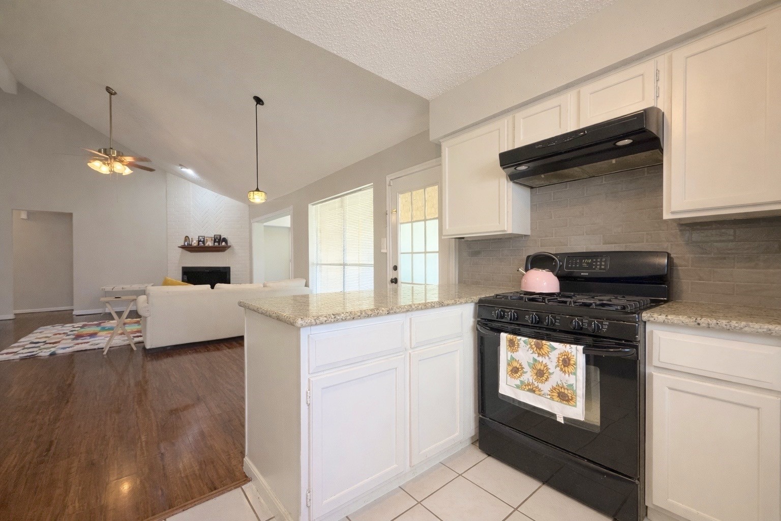 17007 Spruce Run Drive Spring, TX 77379 - Photo 9 of 23 a kitchen with stainless steel appliances granite countertop a stove a sink and a microwave