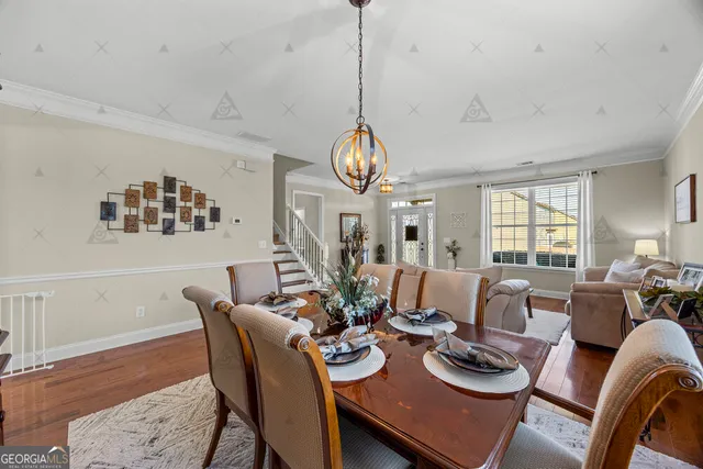 a kitchen with a refrigerator a sink dishwasher and wooden cabinets