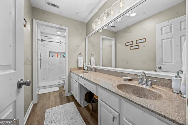 a bedroom with bed and a large window