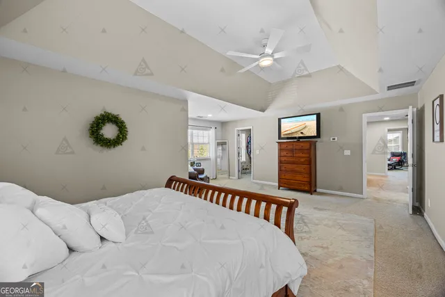 a white tub sitting in a bathroom next to a window