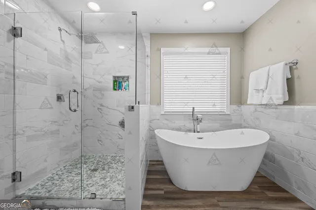 a view of walk in closet with clothes