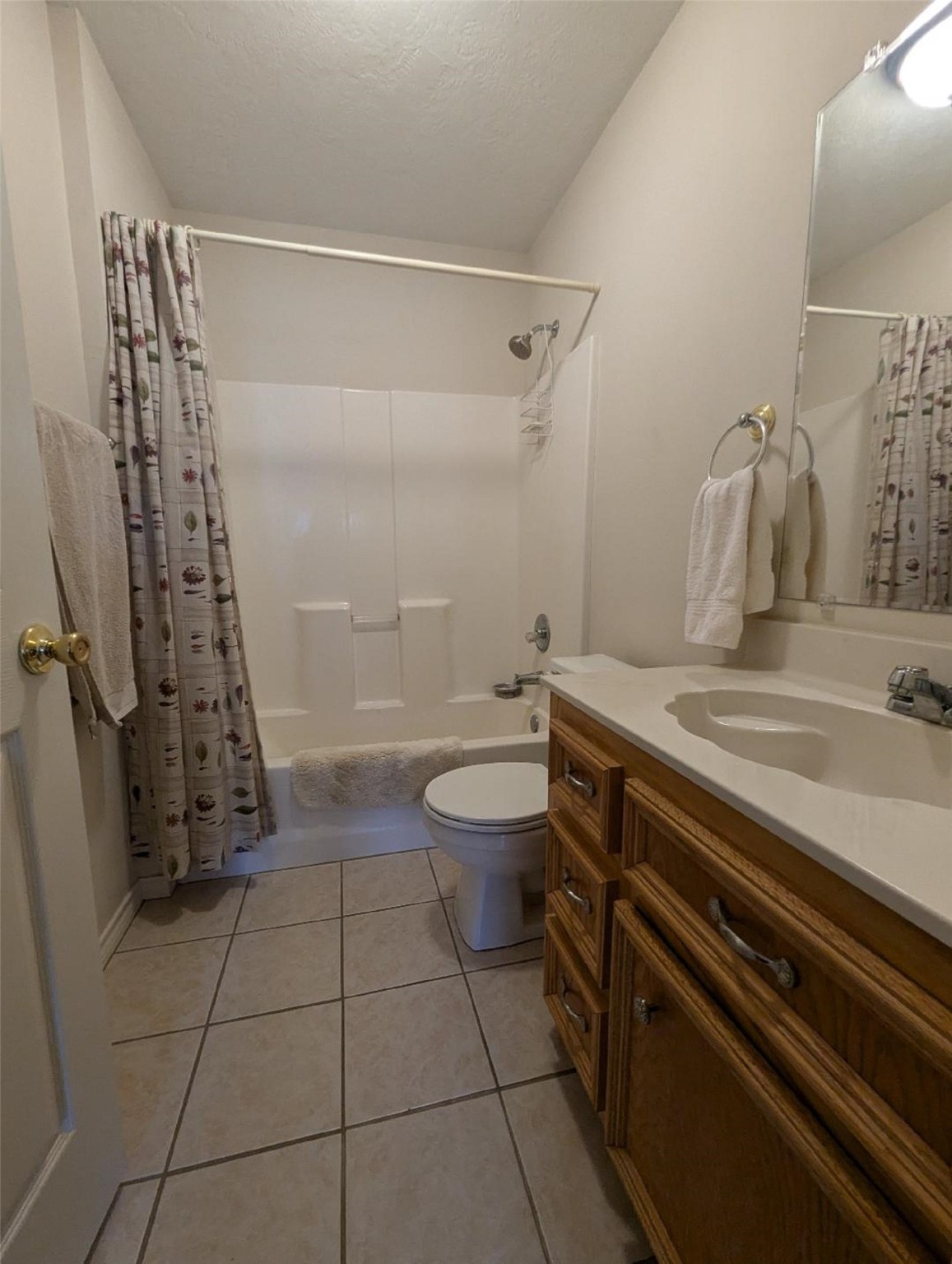 141 Coral Gables Trinity, TX 75862 - Photo 26 of 42 a bathroom with a granite countertop sink toilet and shower