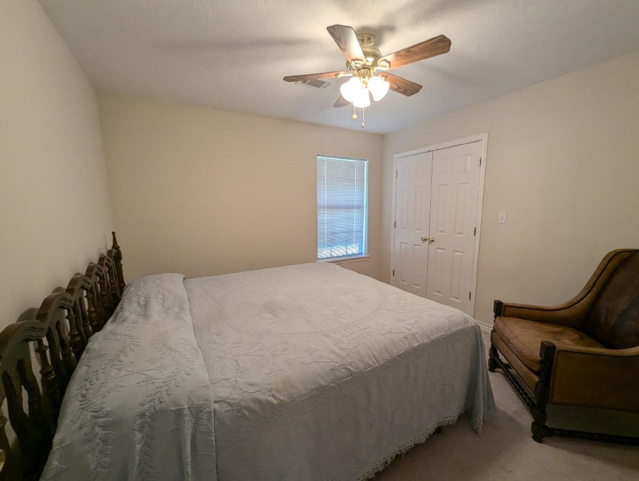 141 Coral Gables Trinity, TX 75862 - Photo 27 of 42 a bedroom with a bed and a chandelier