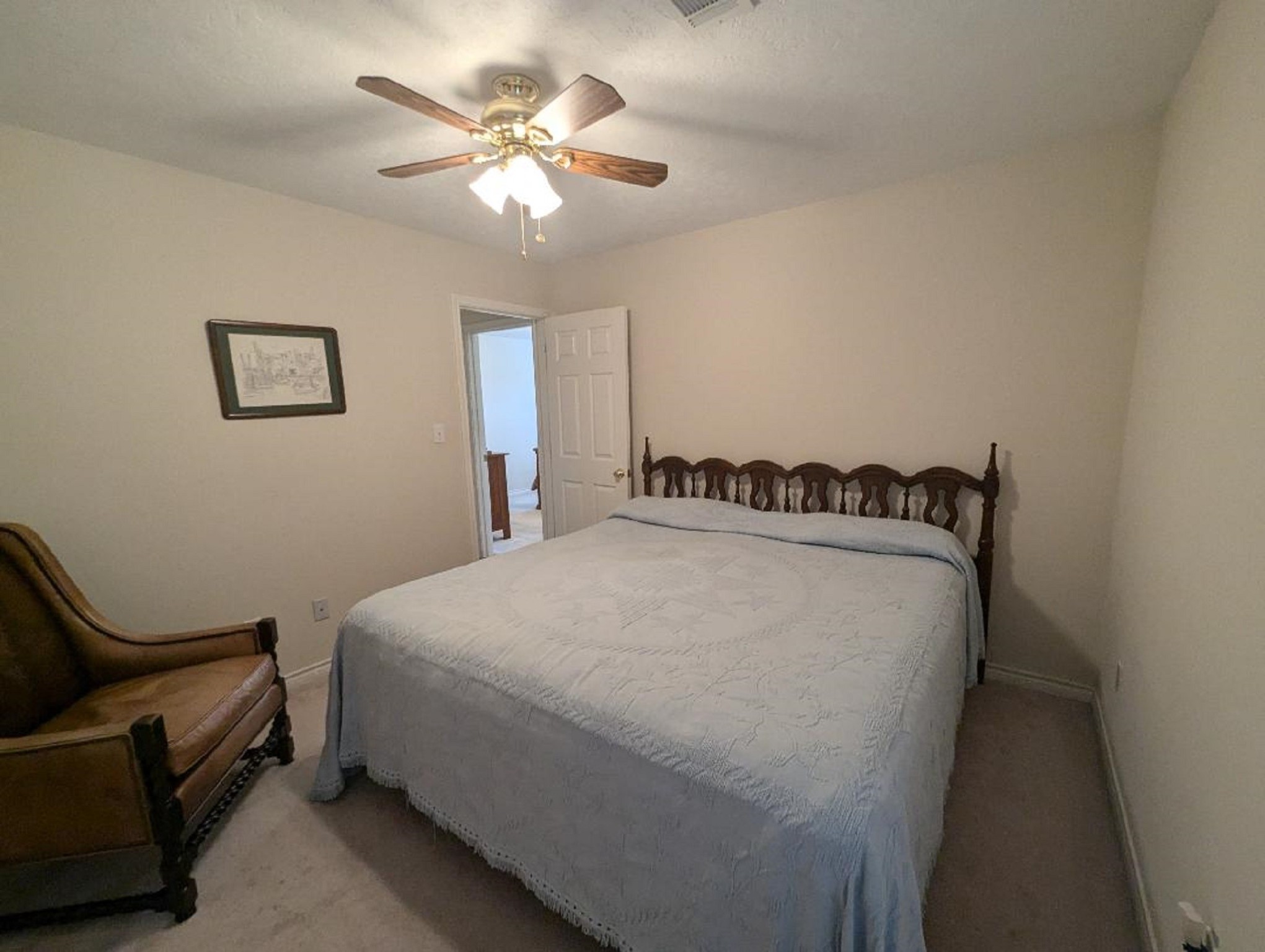 141 Coral Gables Trinity, TX 75862 - Photo 29 of 42 a bed room with a bed and a chandelier