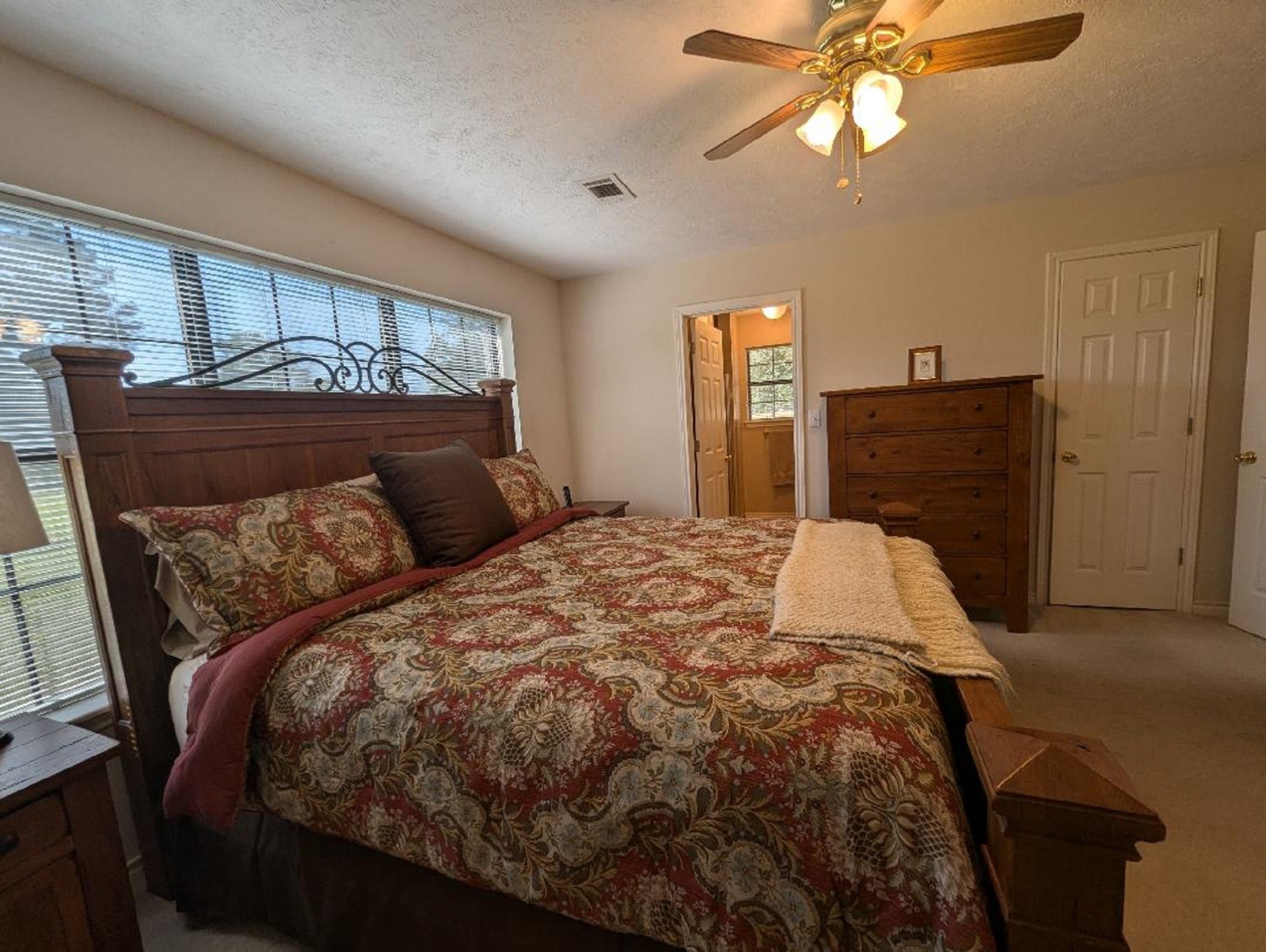 141 Coral Gables Trinity, TX 75862 - Photo 31 of 42 a bed sitting in a bedroom next to a window