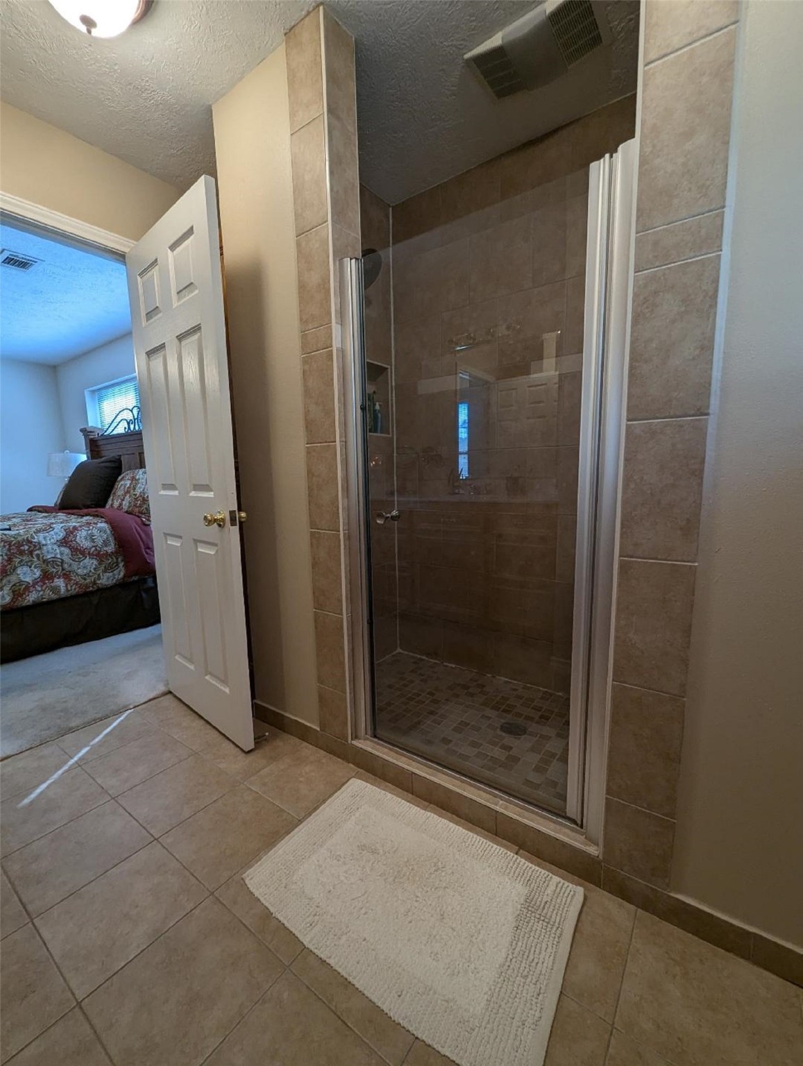141 Coral Gables Trinity, TX 75862 - Photo 36 of 42 a bathroom with a shower and closet