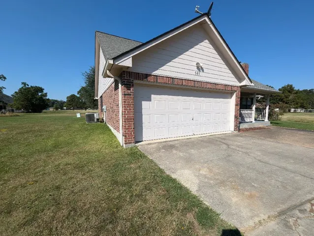 a view of garage and yard