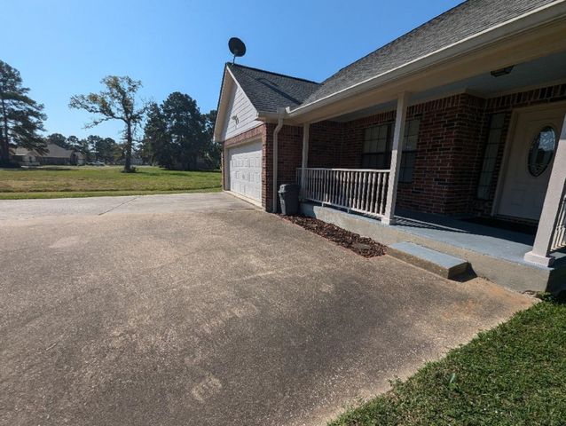 a view of backyard and deck