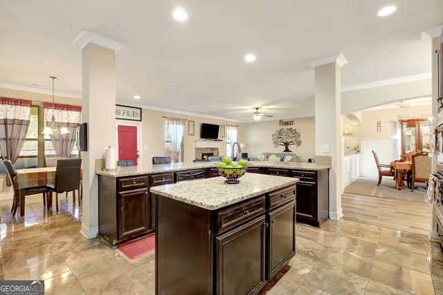 a kitchen that has a lot of cabinets a sink in it and appliances
