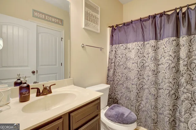 a view of a livingroom with a ceiling fan and a ceiling fan