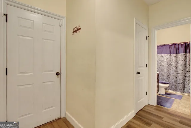 wooden floor in a hall with a window