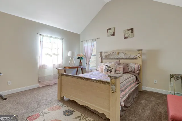 a view of a hallway with wooden floor and entryway