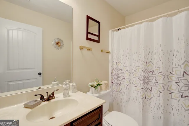 a view of a patio with a table and chairs under an umbrella