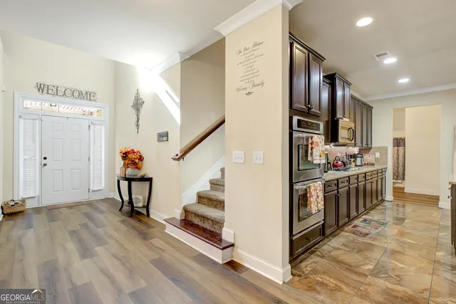a view of kitchen with furniture and wooden floor
