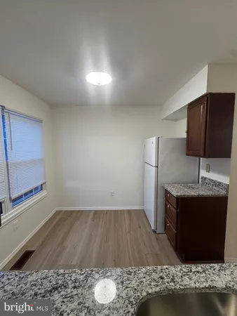 a room with wooden floor and furniture