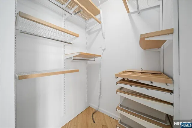 a bathroom with a granite countertop sink and a toilet