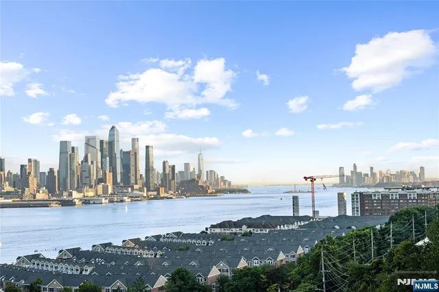 a view of a kitchen with a sink and cabinet