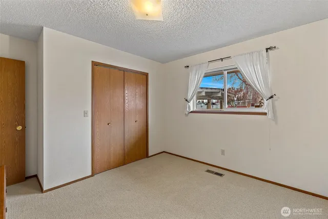a view of a house with wooden deck