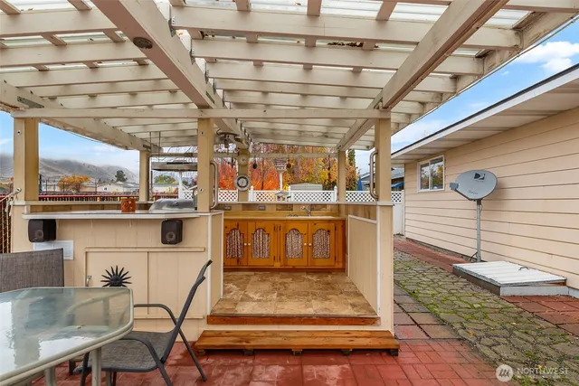 a view of a backyard with sitting area