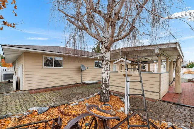 a view of a backyard with sitting area