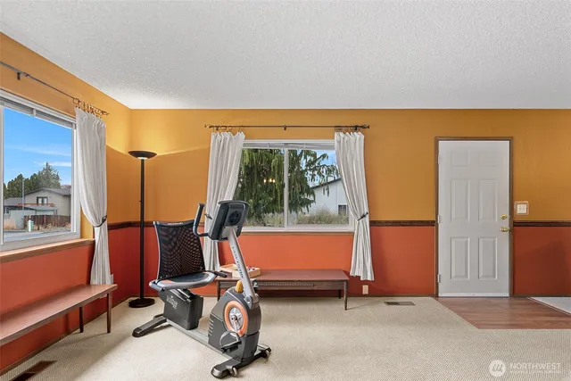 a view of kitchen with furniture and a chandelier